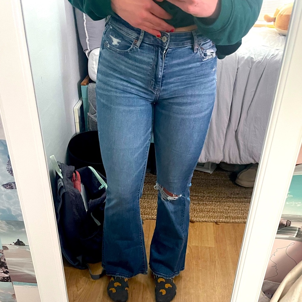 American Eagle high waisted flare bottom jeans, knee rip, worn once, soft fit